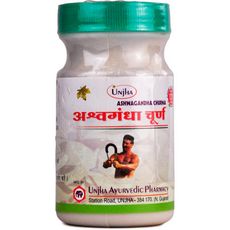 Herbal supplement jar with green lid and Hindi text on label.